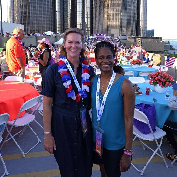 Mary Culler, president of Ford Philanthropy, with Tonishia Holloway, a Ford Test Planner and member of the Ford Volunteer Corps at the 2025 Ford Fireworks.