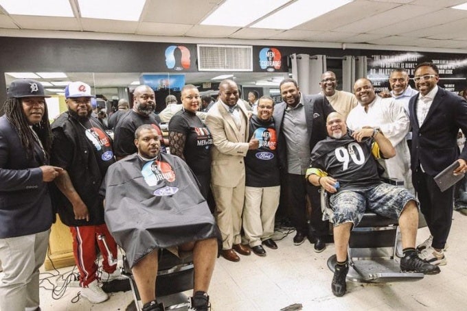 A group of people in a barbershop