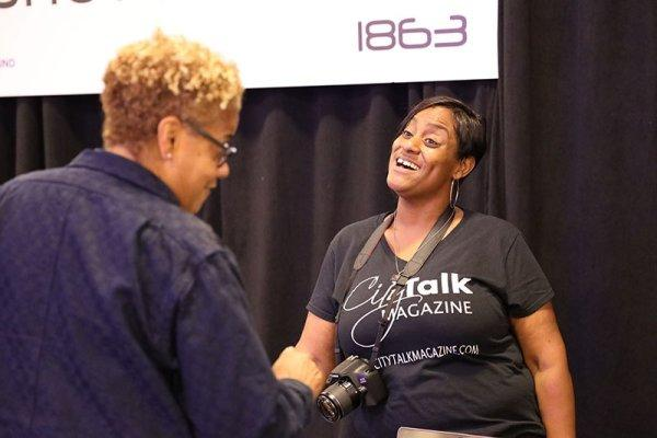 Bradley Melissa shaking hands with another woman