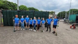 A group of volunteers at an event in an open field