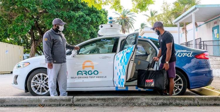 Volunteers with a car