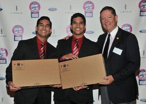 3 men posing for a photo