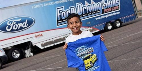 a kid with a ford shirt