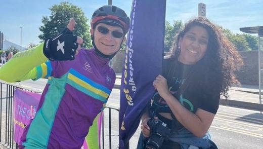 Two people standing in an open field