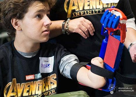 Child fan of Avengers with a 3d printed fist