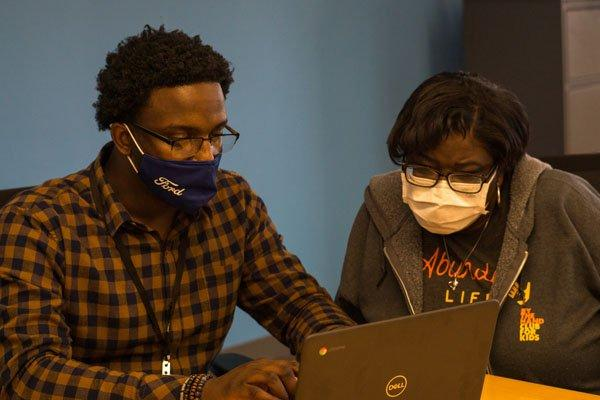 two people in a computer