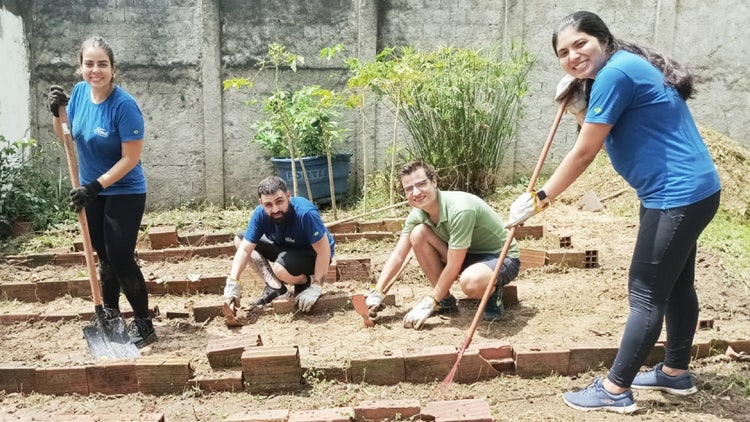 A group of people working in a yard