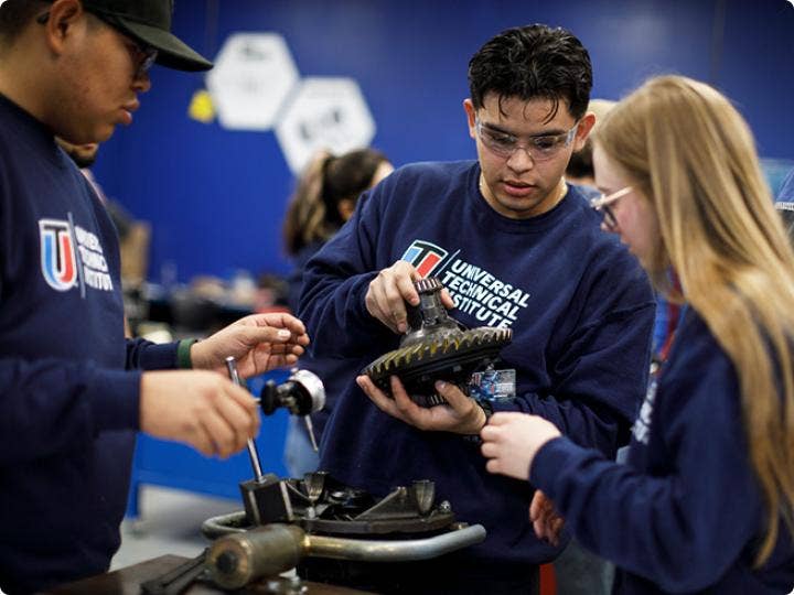 Two boys and a girl at a technical training
