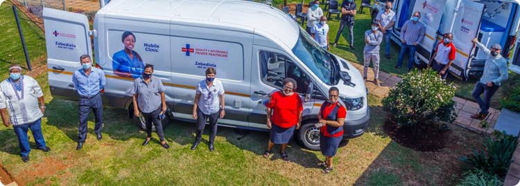 people standing in front of van