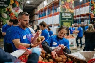 Ford Volunteers packing food boxes