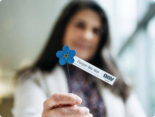 A symbol for an organization on the hand of a woman