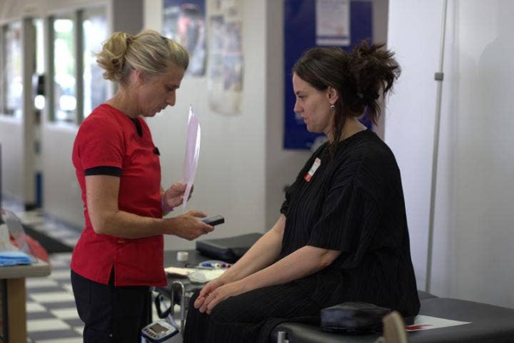 A person talking to a doctor AI-generated content may be incorrect.