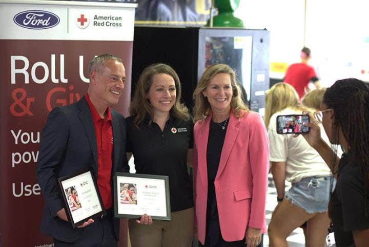 A group of people holding certificates AI-generated content may be incorrect.