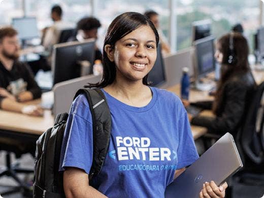 A girl with her notepad and backpack at a Ford student program