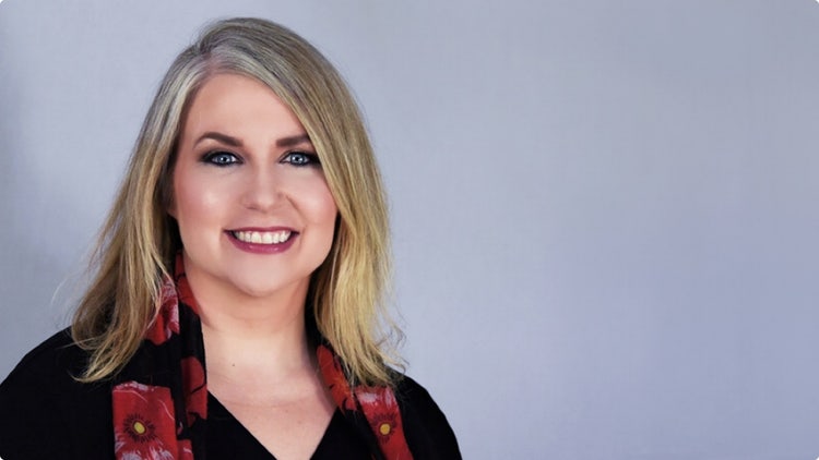 Portrait of a woman with gray background