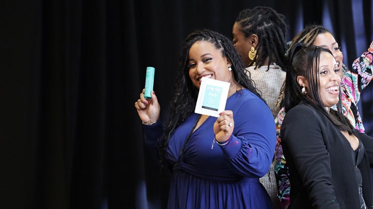 A woman celebrating a prize